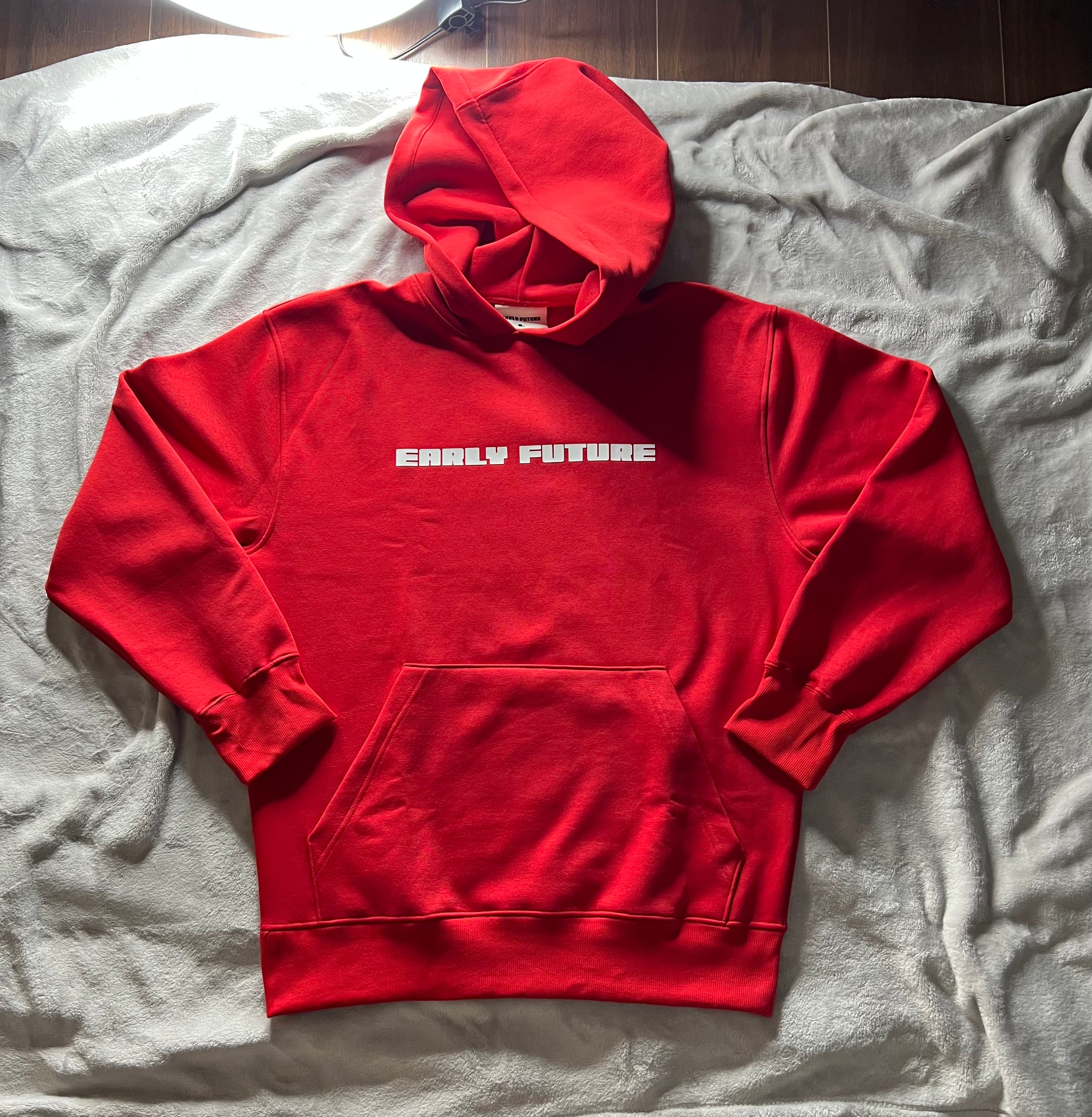 Red "NECESSARY" Hoodie.